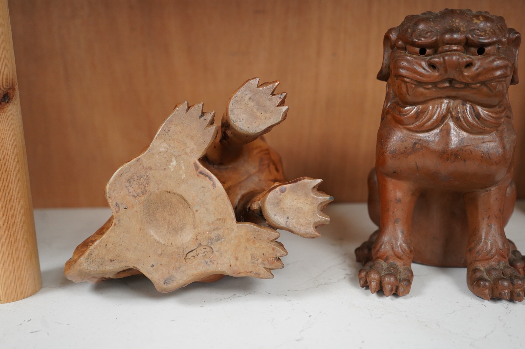 A pair of Japanese Bizan ware lion dogs (shi shi), 18cm high